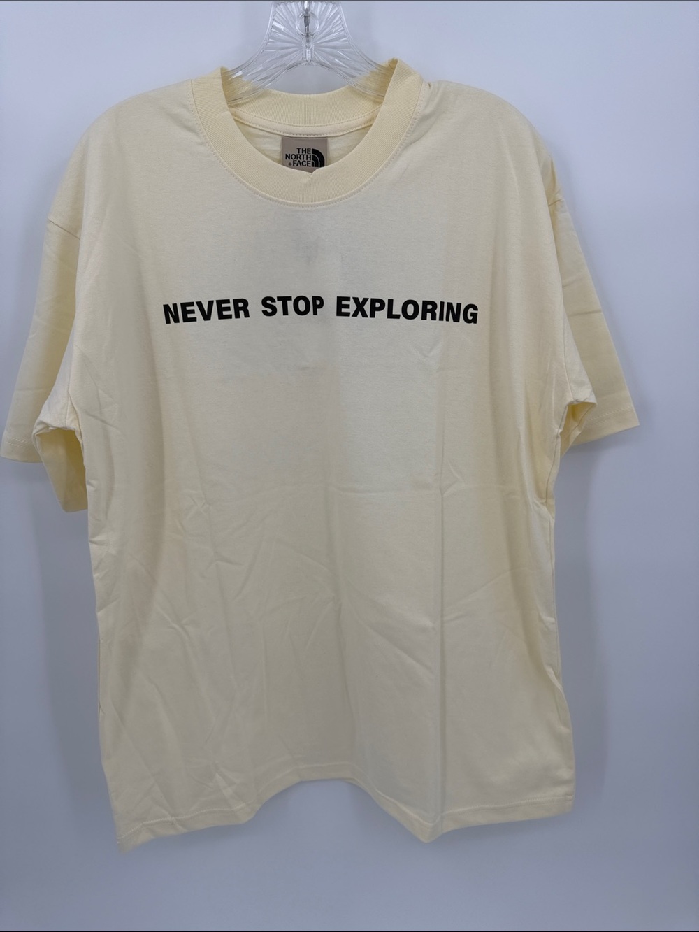 The North Face Cream Graphic 'Never Stop Exploring' Tee